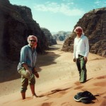 Bill Edwards and Ian Linington standing on top of a sand dune in Wadi Rum