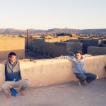 Gavin Mooney, Bill Edwards and Ian Linington enjoying view on roof Atar desert hills
